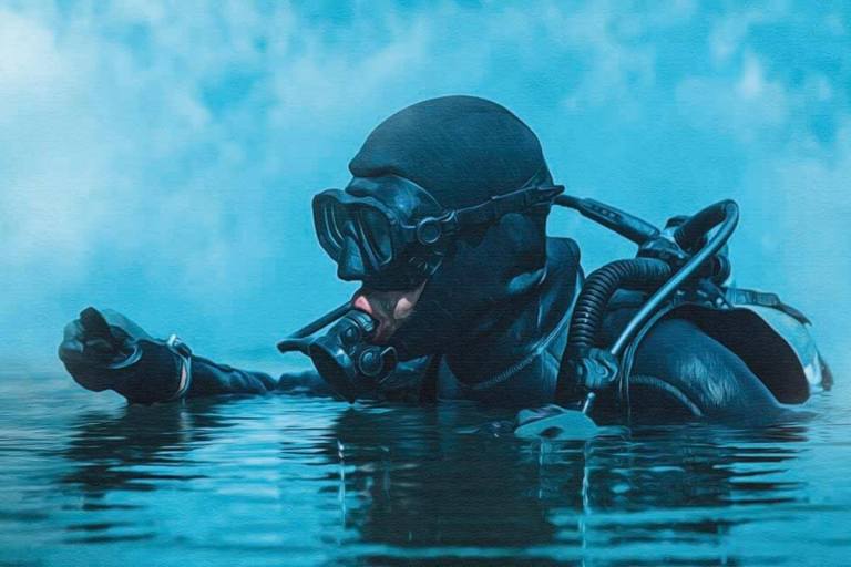 A scuba diver wearing a black wetsuit, mask, and snorkel gear emerges from blue water, with only their head and arm visible above the surface. The background is blurred in cool blue tones.