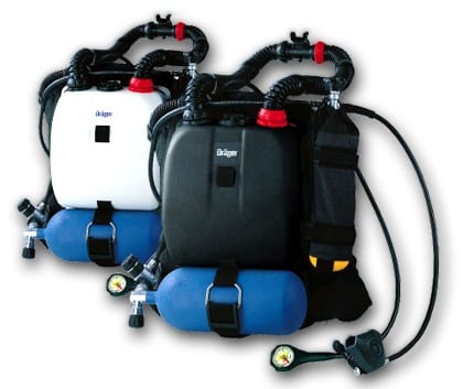 Two closed-circuit rebreather scuba units, one white and one black, each equipped with blue gas cylinders, pressure gauges, and breathing hoses.